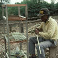 A Wichí carpenter creating shelves from bamboo, Argentina. &copy; Survival International