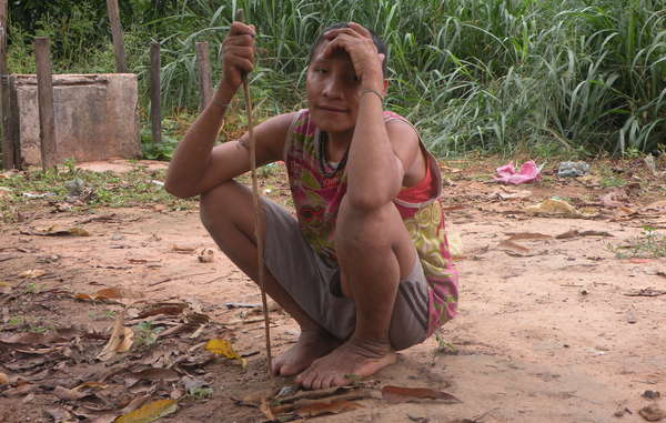 Uncontacted Awá Indians Irahoa and two relatives made contact with a settled community. Their forest has been invaded by loggers, who have attacked the Awá in the past.