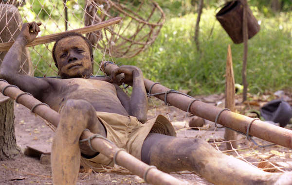 A man from the Onge tribe relaxing in his hammock, Andaman Islands.