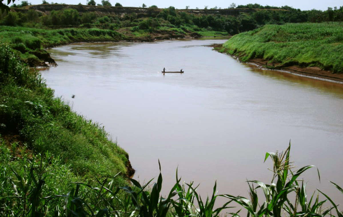 Kwegu men, fishing on the Omo River, Ethiopia.