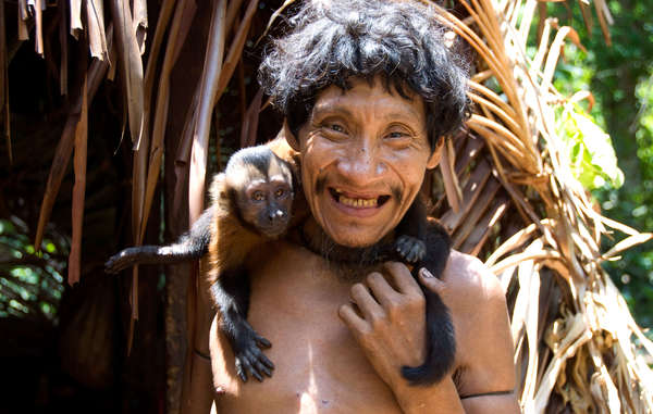 Takwarentxia with a monkey, Juriti community, Brazil.