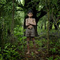 Druku is from one of the resettlement villages, Sakata, at the bottom of the Niyamgiri hills. With little to do during the day, he spends it wondering and playing in the forests around him, sometimes hunting for small birds with his sling-shot or collecting wild foods. &copy; Jason Taylor/Survival