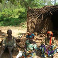The roof of this Batwa hut was destroyed as part of a government scheme to rid Rwanda of all thatched housing. Hundreds of Batwa families have been left without shelter as a result. &copy; <span class="caps">COPORWA</span>/Survival
