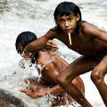 Zo'é children play in a waterfall &copy; Fiona Watson/Survival