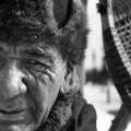 Elder Shoashim Nui, the community's most skilled carpenter, beside a pair of his renowned snowshoes. &copy; Dominick Tyler/Survival