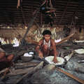Yanomami women baking manioc bread in their Maloca, Brazil. &copy; Victor Engelbert/Survival