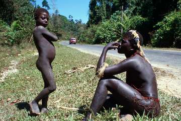A Jarawa man and boy by the side of the Andamans Trunk Road