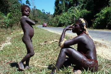 A Jarawa woman and boy by the side of the Andamans Trunk Road