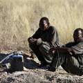 Two men from Kikao wait for water at the Mothomelo borehole &copy; Vox United/Survival