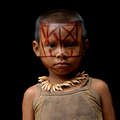 A Nukak child wearing a necklace made from monkey teeth. &copy; Juan Pablo Gutierrez