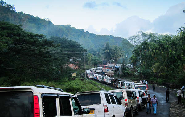 Vehicles queue to enter the Jarawa reserve along the Andaman Trunk Road