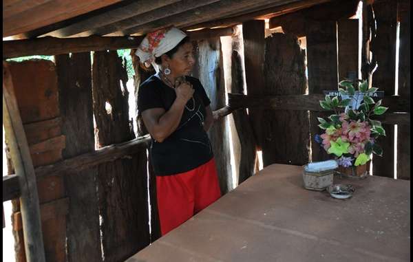 Genivaldo Vera's mother next to his tomb. He was killed by gunmen in 2009.