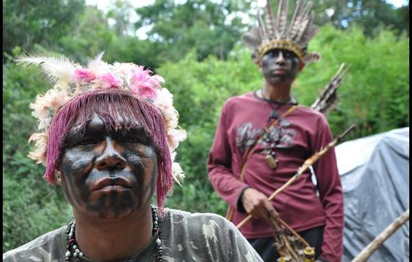 Guarani Indians have traveled to Brasília to warn of the violence they are forced to endure. 