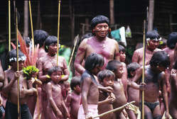 Davi Kopenawa, indigenous leader and shaman, surrounded by children in Demini, Brazil