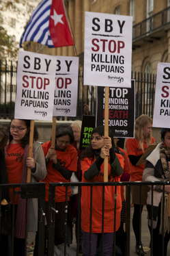 Dozens of protesters gathered outside Downing Street to mark the visit of Indonesia's President.