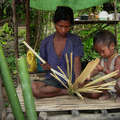 Batak mother and child splitting bamboo, Palawan, The Philippines &copy; Dario Novellino/Survival