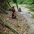 Batak women taking a rest on the shores of the Tanabag river after the harvesting of wild bamboo, Palawan, The Philippines &copy; Dario Novellino/Survival