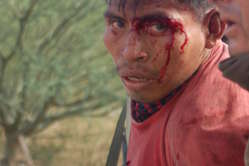 One of many Indians wounded in the Bagua protest is arrested.