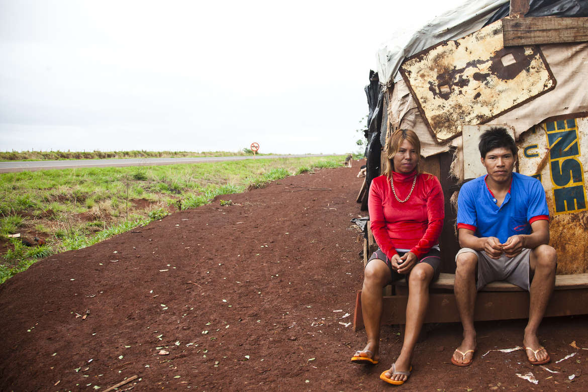 A Guarani-Kaiowa couple outside their makeshift roadside settlement of Apyka’y, near Dourados, Brazil.