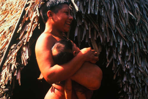 Korubo mother and child in the Javari Valley around the time of first contact in the mid nineties, Brazil. Located on the border of Brazil and Peru, the Javari Valley is home to seven contacted peoples and about seven uncontacted Indian groups, one of the largest concentrations of isolated peoples in Brazil. 