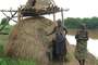 Kwegu_and_mun_by_river_thumb