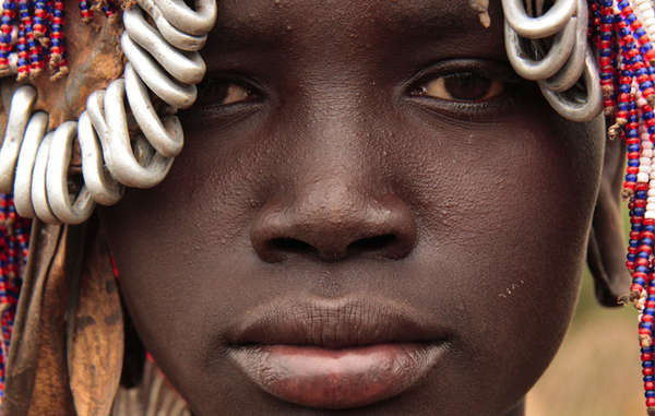 A girl from Ethiopia's Mursi tribe, which faces intimidation from Ethiopia's security forces