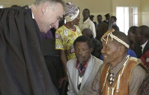 The Bushmen's lawyer Gordon Bennett with his clients in 2004. He has since been barred from entering the country.