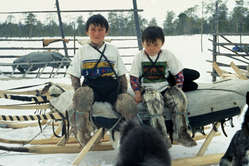 Khanty children of Siberia on a sleigh.