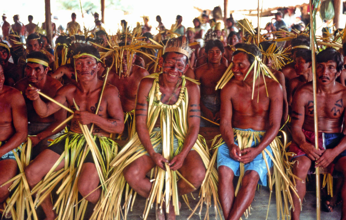 Makuxi men wearing traditional parishara costumes for a meeting at Bismark to discuss their land claims, Raposa Serra do Sol, Brazil.