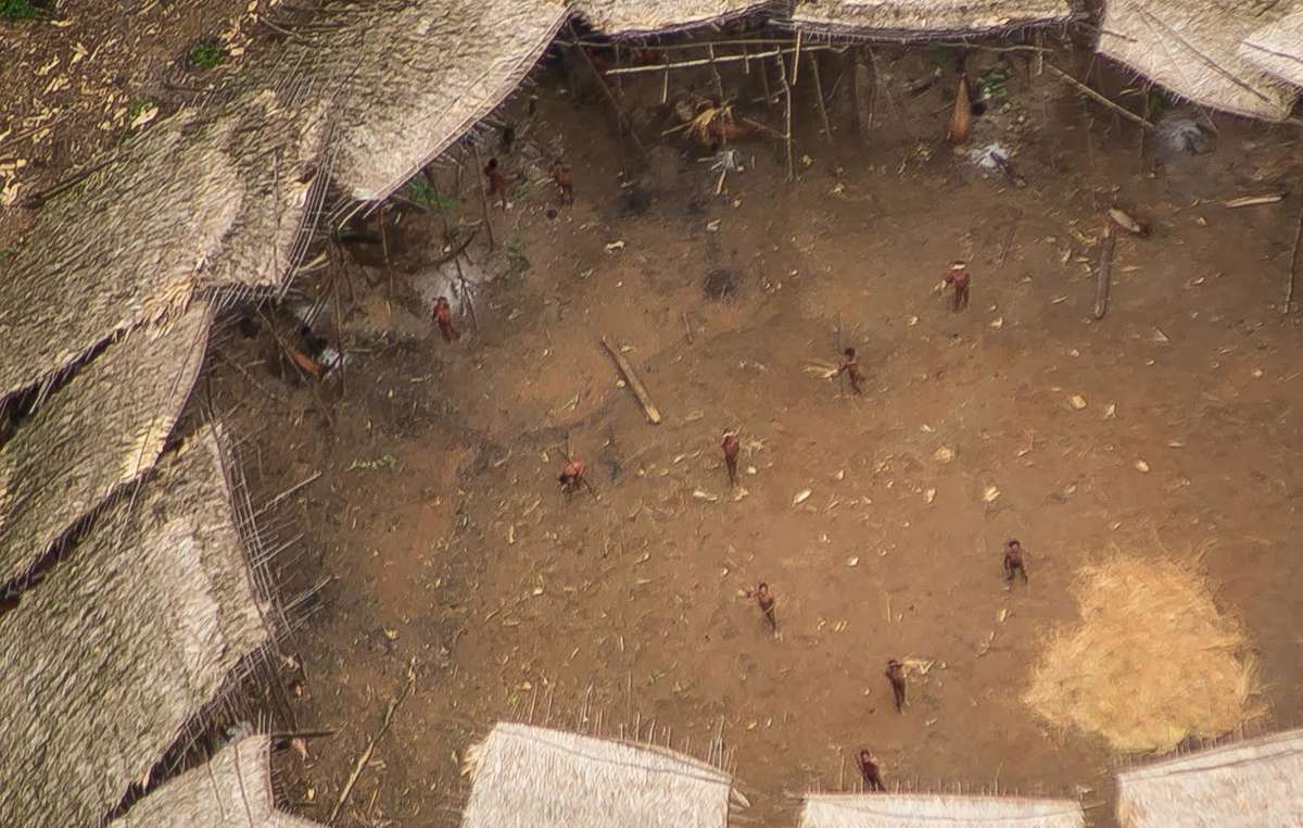 Uncontacted Yanomami seen from the air in the center of their yano, estimated to be home to around 100 individuals.