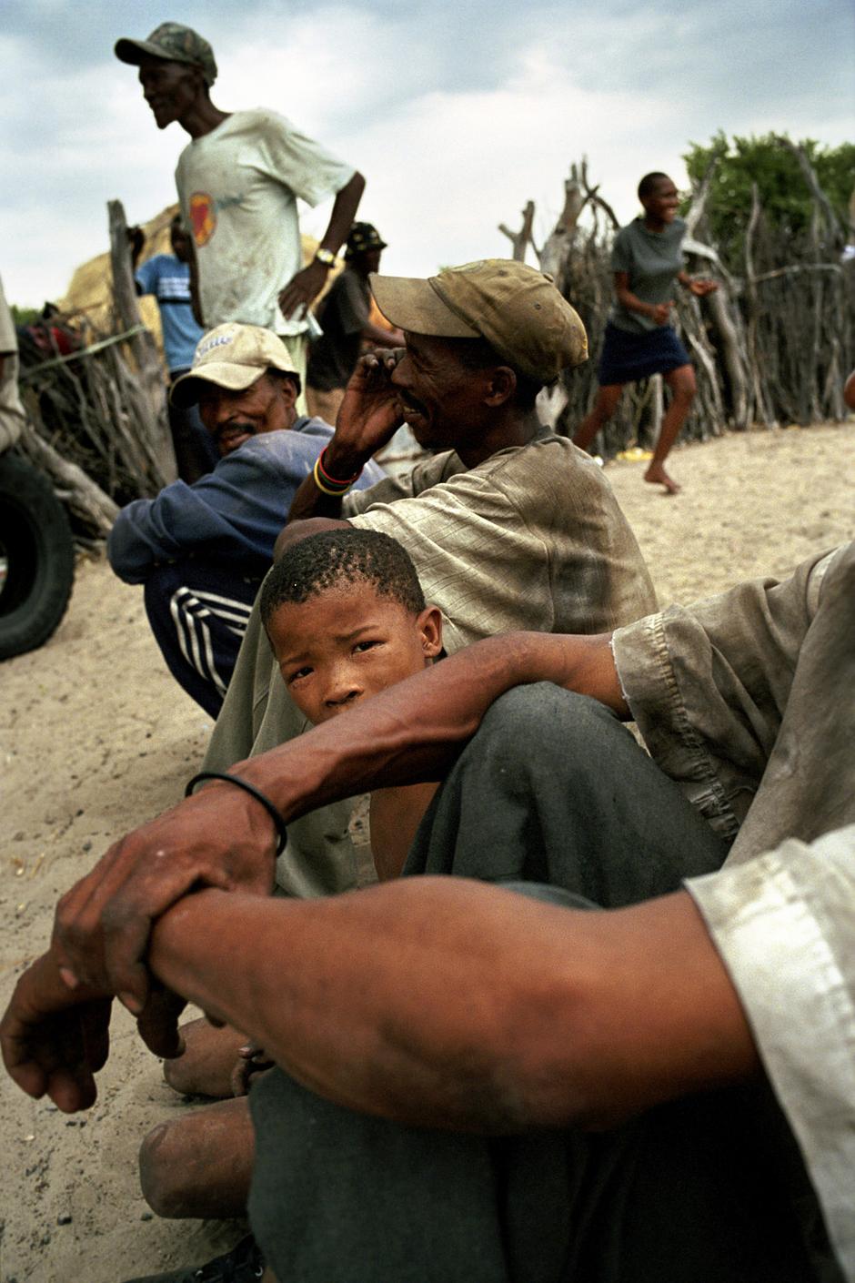 Bushmen in Molapo, a community inside the CKGR, greet family members and friends who have just returned from exile in New Xade.