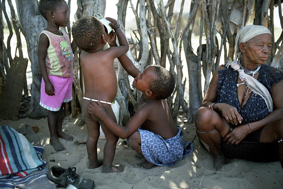 Young children in Metsiamenong drink water obtained from a distant borehole.

One of the ways the government tried to make their home-coming impossible, was by banning them from accessing a water borehole inside the reserve. As rainfall patterns are unpredictable in the CKGR, a borehole is their main source of water.

In June 2010, the Bushmen launched further litigation against the government in a bid to gain access to their borehole.

In the court hearing, the judge ruled that the Bushmen were not entitled to access an existing water borehole on their lands, nor drill a new one, and that they had ‘brought upon themselves any discomfort they may endure.’

At the end of January, however, the judge's ruling was overturned by a unanimous decision of five Appeal Court judges, who ruled that denying Bushmen access to their well amounted to ‘degrading’ treatment, contrary to the country’s Constitution.