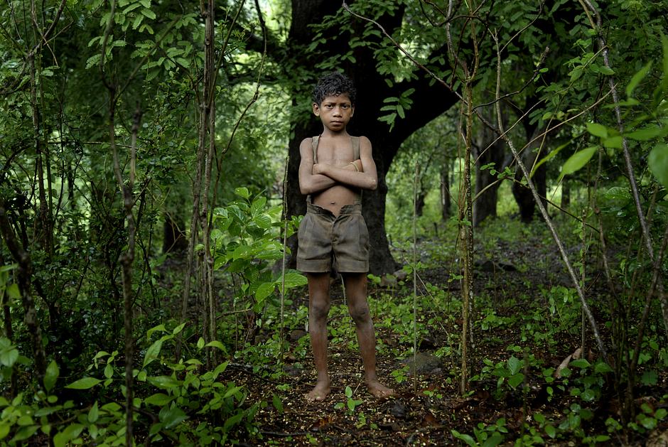 To be a Dongria Kondh is to live in the Niyamgiri Hills in Orissa state, India. But the mountain that the Dongria revere as a god is under threat from mining companies who are eyeing the $2billion deposit of bauxite that lies beneath.

Niyamgiri has always provided physical and spiritual sustenance for the Dongria. To lose their lands to open pit mining would be to lose their livelihoods and unique identity as a people, for the extraction would destroy the forests and disrupt the rivers. "We are mountain people. If we go somewhere else, we will die," they say.

In 2014 the Dongria won a David and Goliath battle against mining on their hills, but those who resisted the mine are still facing a violent police campaign of harassment and intimidation. 

"Where will we children go? How will we survive?" asked a young Dongria Kondh boy when contemplating the possibility of having to leave his home. "No, we won’t give it up. We won’t give up our mountain!"

(Image shows Dongria Kondh boy, Orissa, India).