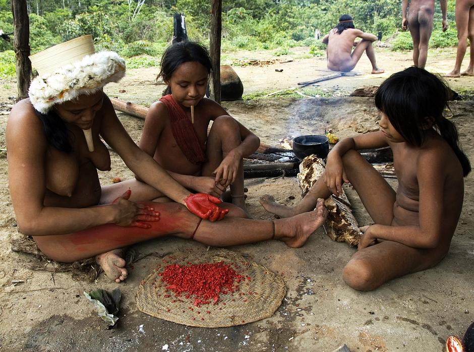 The Zo’é are a small, isolated tribe who live deep within the Amazon rainforest. 

From a young age the Zo'é wear a long, wooden plug inserted into the lower lip. 

Zo'é women paint their bodies with _urucum_ - a vibrant red paste made from crushed annatto seeds.