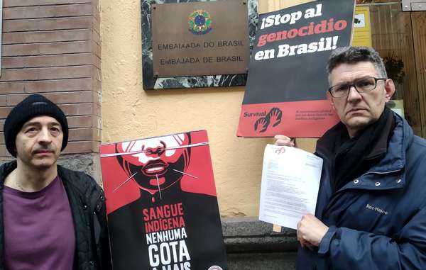 Protesters in Madrid, Spain handing a letter to the Brazilian Embassy, calling for an end to indigenous rights violations.