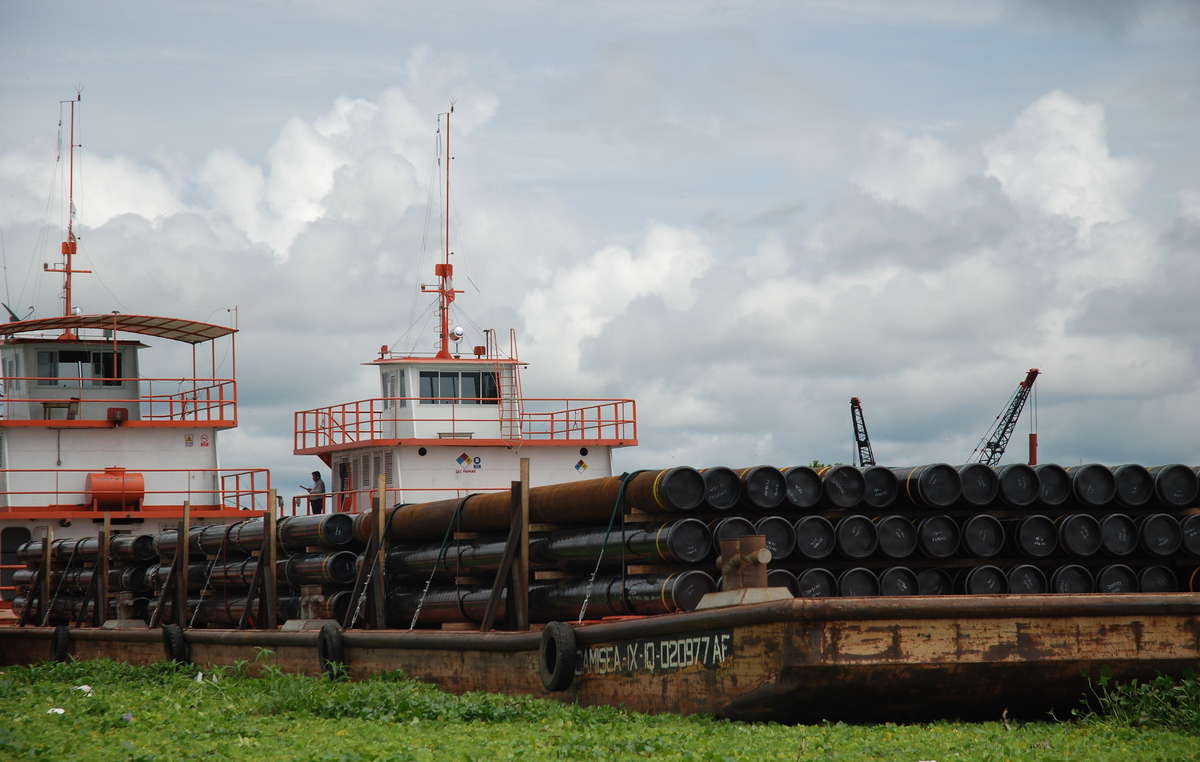 Oil industry barges are a constant sight on the rivers of northern Peru