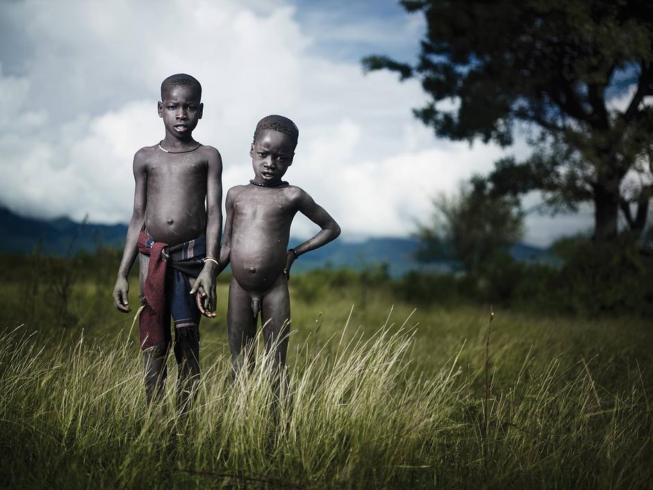 Oral traditions are shared with children from a young age. The tribe’s creation story tells of their ancestors crawling from a hole in the ground near the Omo River.

_This picture is "available as a greetings card":http://shop.survivalinternational.org/products/joey-l-greetings-cards, with all profits going to Survival's campaigns._