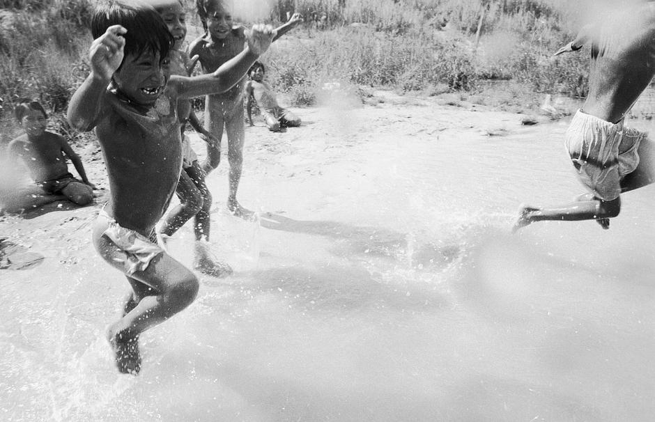 For the Guarani people of Brazil, land is a precious gift from the great father. 

Today, however, the endless deforestation of Mato Grosso do Sul in southern Brazil has turned their ancestral lands into a dry, treeless region of cattle ranches, soya fields and sugar cane plantations.

Many Guarani now live in appalling conditions in overcrowded reserves or make-shift camps on roadsides. As they have lost almost all their forest in the past 100 years, leaving them with very little land on which to cultivate crops, their children have been suffering from malnutrition.  A 2008 report revealed that 80 Guarani children had died as a result of malnutrition alone in the previous 5 years.

_Many children are suffering,_ said a Guarani health agent. _I want the children to be as they were before, when all was OK._ An improvement in the lives of the Guarani starts with the Brazilian government ending the wholesale destruction of the Indians’ land.

(Image shows Guarani children, Brazil).