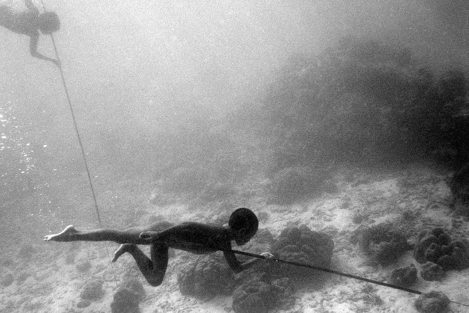 The Moken are a semi-nomadic Austronesian people, who live in the Mergui Archipelago in the Andaman Sea.

Like other tribal children, the Moken young learn to ‘read’ nature through experience and observation. They have developed the unique ability to focus underwater, using their visual skills to dive for food on the sea floor. _The Moken are born, live and die on their boats, and the umbilical cords of their children plunge into the sea_ recounts a Moken myth.  Another suggests that Moken children learn to swim long before they can walk.

Their semi-nomadic numbers have diminished in recent years due to political and post-tsunami regulations, companies drilling for oil off-shore and governments seizing their lands for tourism development and industrial fishing.  Many have had no choice but to settle in on-shore villages. Losing their ways of life is thus making it increasingly difficult for adults to pass on centuries-old rituals and skills to children.

_This generation no longer knows how to make boats,_ says Hook Suriyan Katale, a Moken man from the Surin Islands, speaking about the 'kabang', the Moken's wooden boat. _Today there are only three or four people left who know our ancient craft._ 

(Image shows Moken children in the Surin Islands, Thailand).