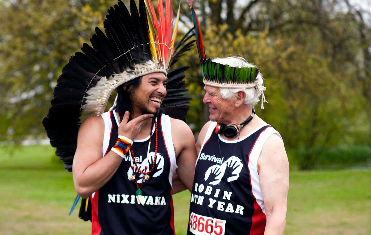 Survival President Robin Hanbury-Tenison and Nixiwaka of the Amazon's Yawanawa people after completing the London Marathon.