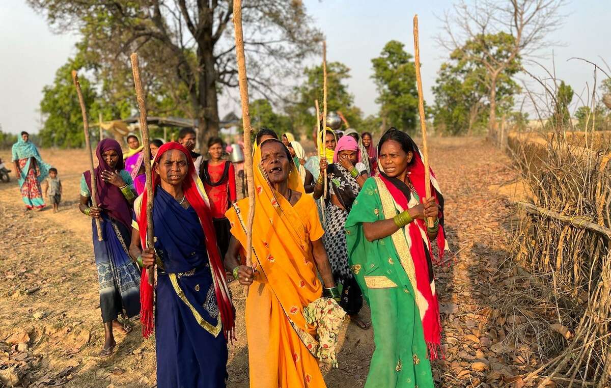 Adivasi women of Hasdeo Forest march as part of the community's protest against coal mining.