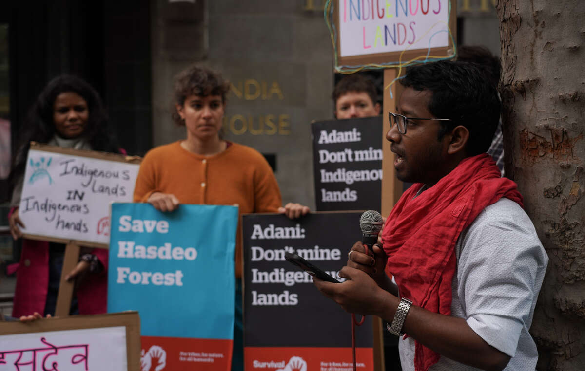 Adivasi activist speaks outside Indian High Commission during day of global action in solidarity with the Adivasi resistance to stop coal mining on their lands in India.