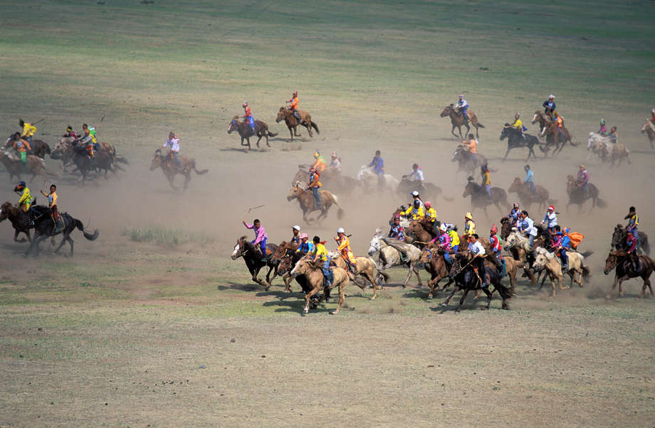 In the _land of the blue skies_, horses are thought to be the messengers of the gods.  Boys are taught to ride before they can walk, learning on silver-engraved saddles that have been passed down the generations.

The biggest Mongolian festival, _naadam_, is held every year, with horse races up 30 kms long; the jockeys are children aged between six and twelve. 

The winning horse is greeted with _Tumay ekh_, meaning _winner of ten thousand_; the last is serenaded with an encouraging song, in order to encourage it to win the following year.
