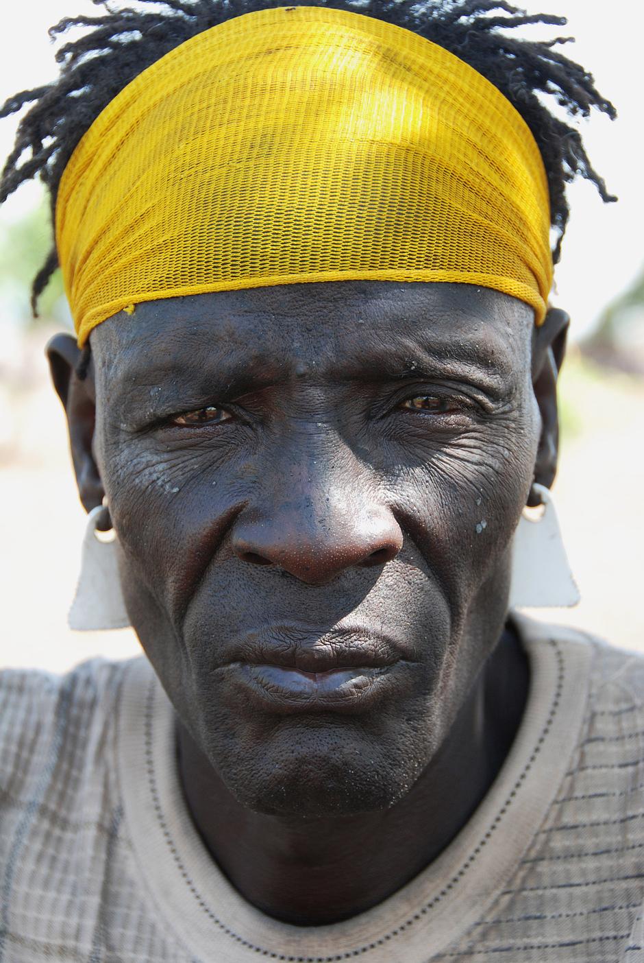 'The government is taking the land by force. There are many machines clearing the bush.

Now there are no trees left.  The rhino and giraffe have no shade.'