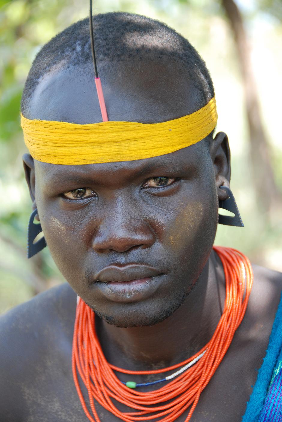 'We are Mursi and we stay on our land. The government is collecting all the people in the Omo Valley to put in one place. 

We have a big, big problem with the government about the sugar cane plantations. Everyone is against them.'