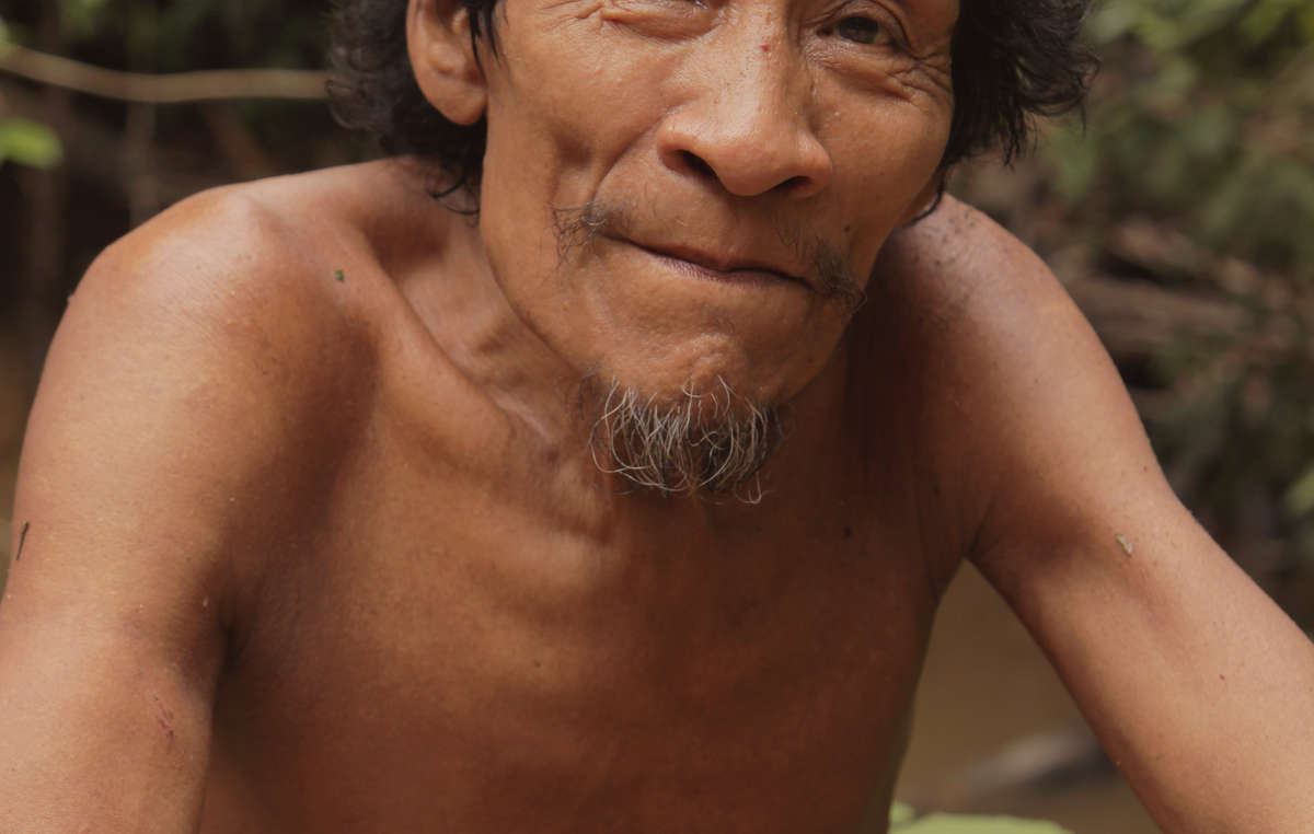 Karapiru saw his entire family massacred by 'karai' (white people). He escaped and lived on his own for 10 years before FUNAI made contact with him. Soon after he was reunited with his son, who had survived the attack.