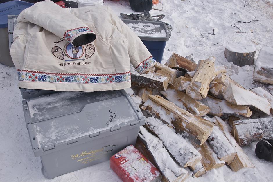 Surrounded by food crates and tins of stove gas, a walker's parka hints at the tragedies that have affected so many Innu families. 

'Justin', an Innu teenager from Natuashish, recently committed suicide.

His friends were walking across the icescape in his memory. 

