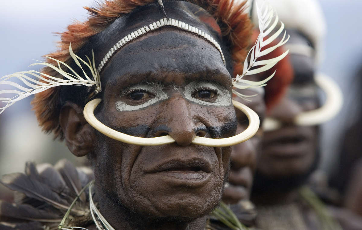 A Papuan Dani man waits before performing at the Festival Budaya in the Baliem valley, West Papua.