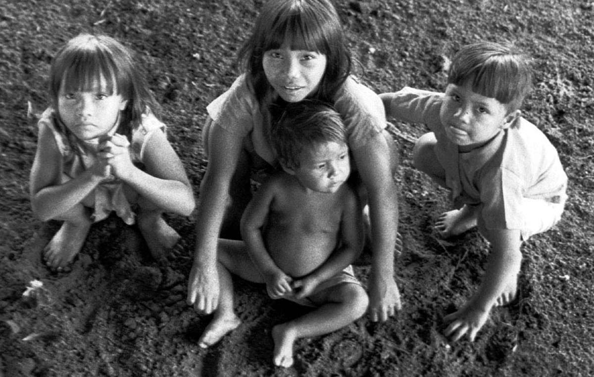 A group of Guarani children, Brazil. As a result of the loss and destruction of their ancestral lands, the Guarani face severe malnutrition as they are no longer able to hunt or fish, and barely have enough land to plant crops on.