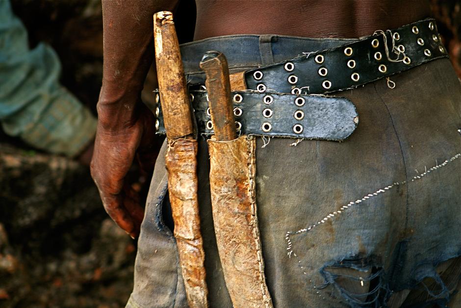 Knife sheaths can be made from impala skin, with the scent gland from the leg visible.  Hadza also make bags from dik-dik leather, which are used to carry knives, pipes, tobacco and arrowheads.

The Hadza accumulate very few material possessions; those they do have are frequently distributed: sharing is fundamental to their ethos.

_As a Hadza, if you have more personal possessions - bows, arrows, stone pipes - than you have immediate use for, then you should share them_, says James Woodburn.  

_To the Hadza, sharing is not an act of generosity_, he continued.  _It is a moral obligation to give what you have without expectation of return_.